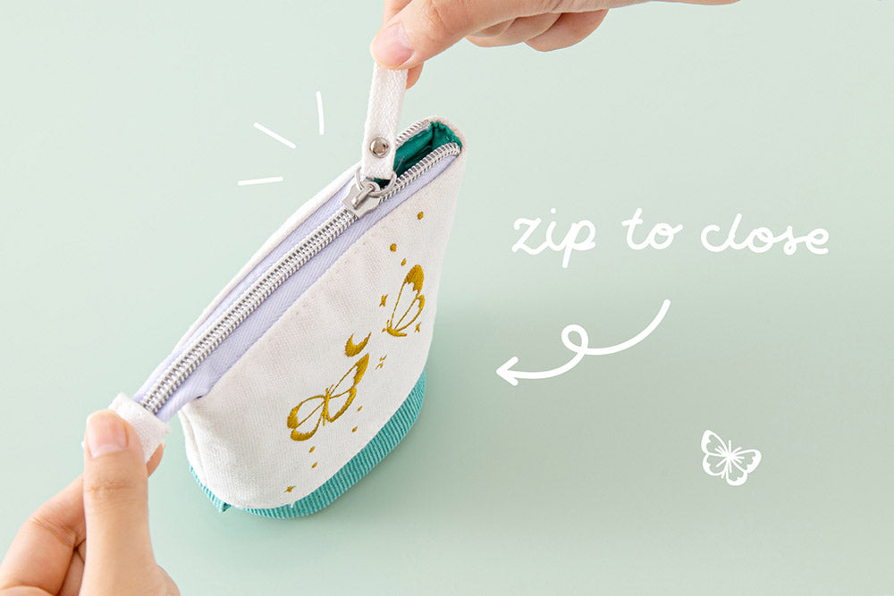 Tsuki ‘Flutter + Dream’ Pop-Up Pencil Case by Notebook Therapy x Pelinkan in teal with zip to close held in hands in mint background