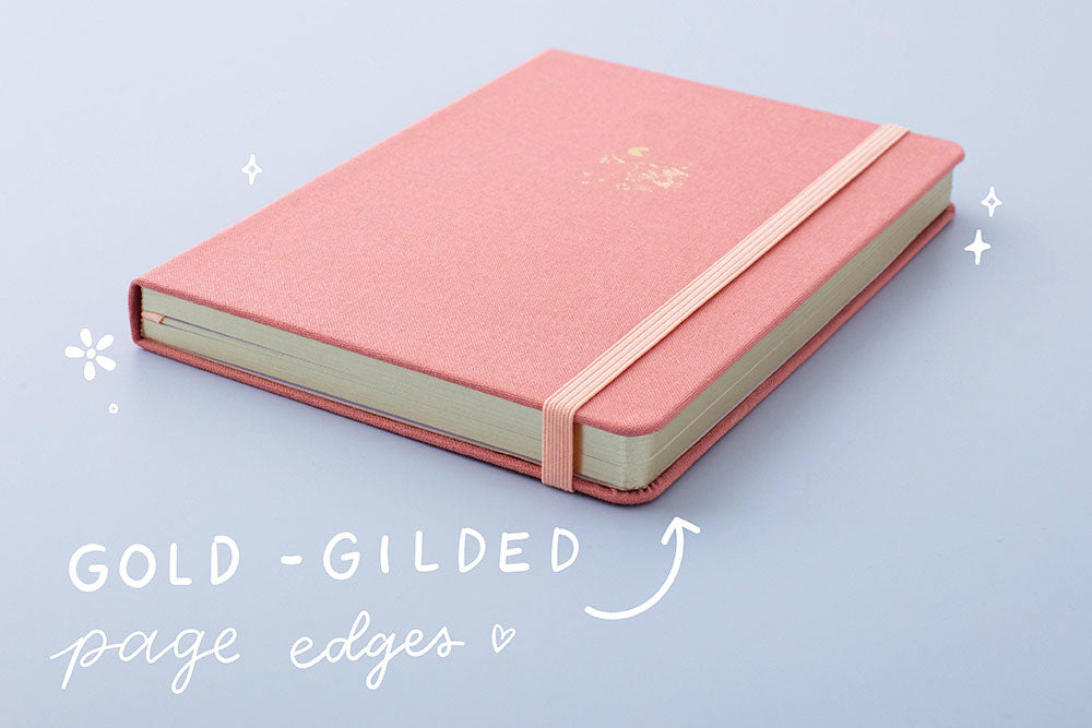 Tsuki ‘Suzume’ Limited Edition Bullet Journal with gold gilded page edges on lilac background