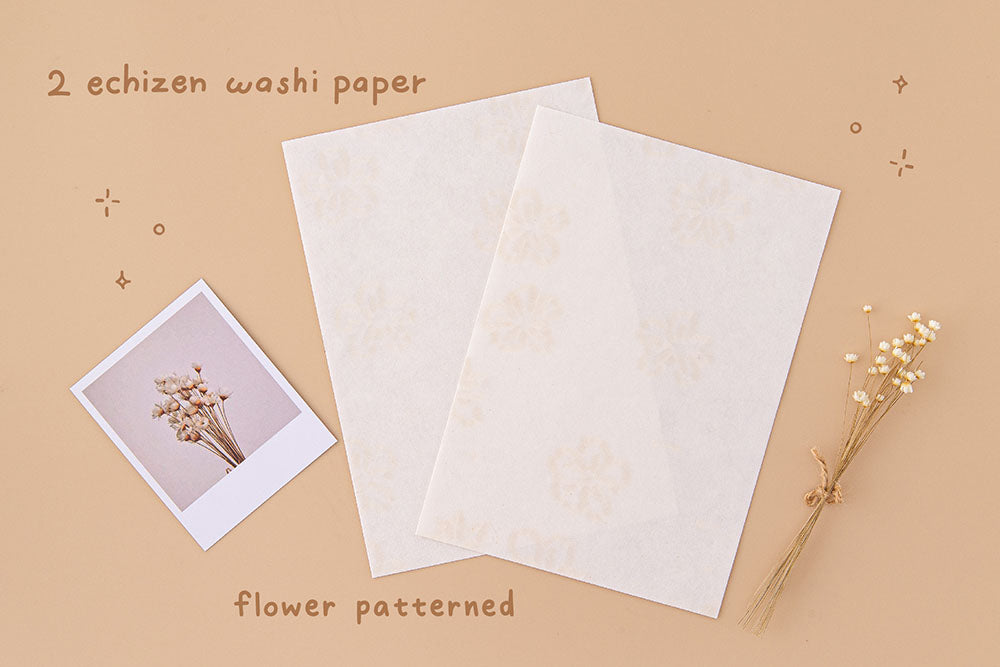 Tsuki Handmade Echizen Washi Petal Papers with flower pattern with dried flowers and polaroid picture on beige background