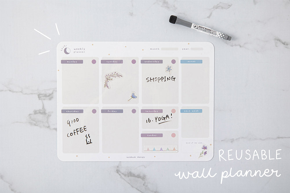 Tsuki Reusable Weekly Wall Planner and dry erase marker on marble surface