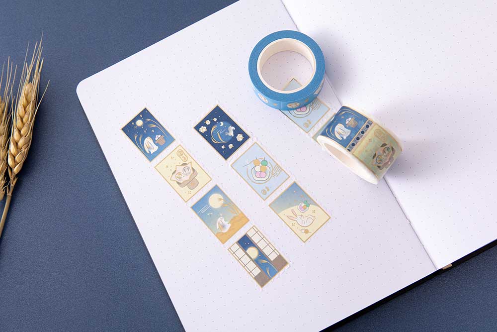 Tsuki ‘Moonlit Wish’ Washi Tapes on open bullet journal pages with wheat reeds on dark blue background