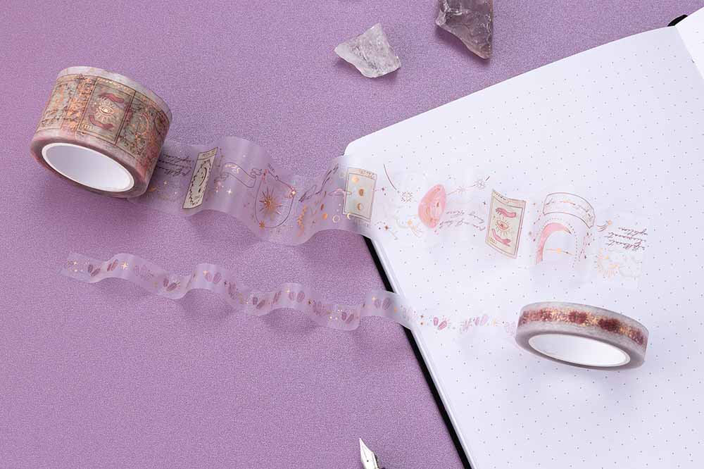 Close up of Tsuki ‘Moonlit Blush’ PET Washi Tapes on open bullet journal page with amethyst stones on purple background