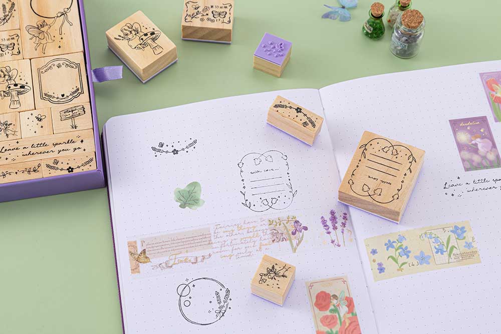 Close up of Tsuki ‘Enchanted Garden’ Stamp Set on dotted notebook with washi tapes