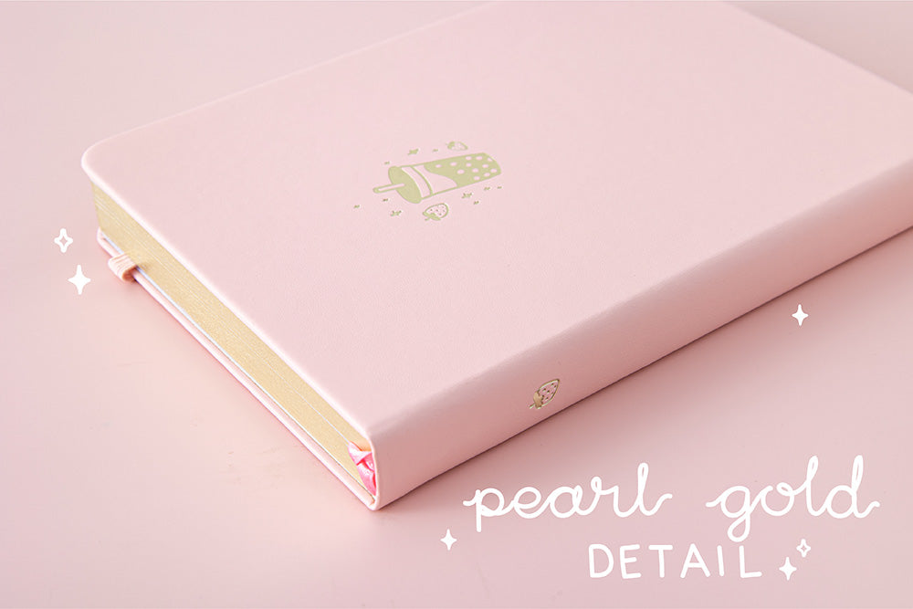 Close up of Tsuki ‘Ichigo’ Limited Edition Boba Bullet Journal with pearl gold details on light pink background