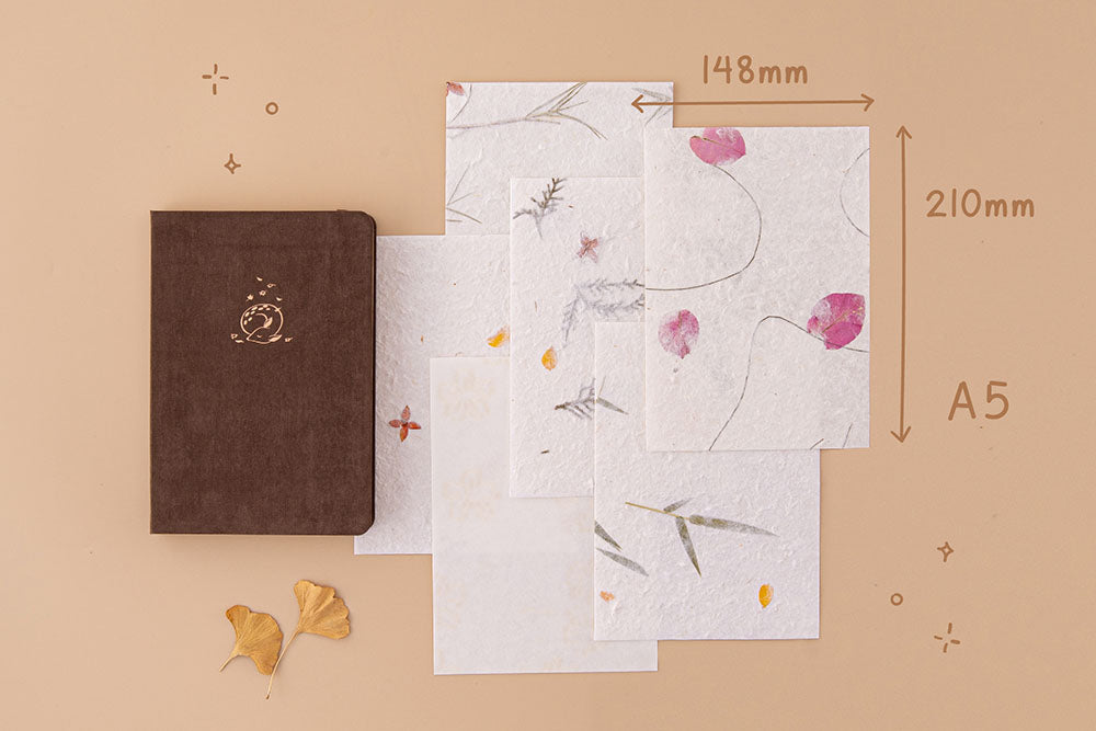 Tsuki Handmade Petal Papers in A5 size with Tsuki ‘Nara’ Limited Edition Bullet Journal and autumn leaves on beige background