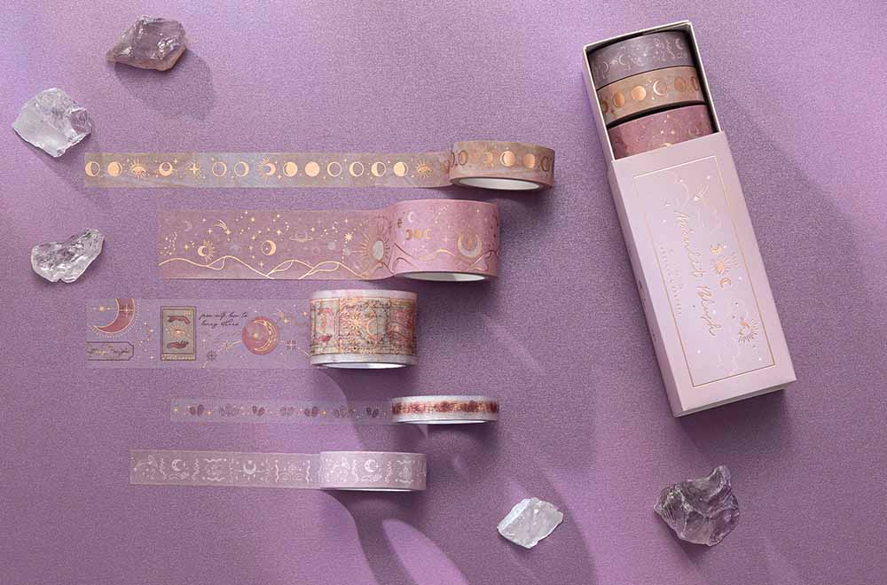 Tsuki ‘Moonlit Blush’ Washi Tape Set rolled out with amethyst stones on purple background