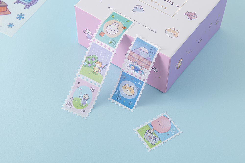 Close up of Tsuki ‘Four Seasons’ Stamp Washi Tape by Notebook Therapy x Milkkoyo on eco-friendly gift box on light blue background