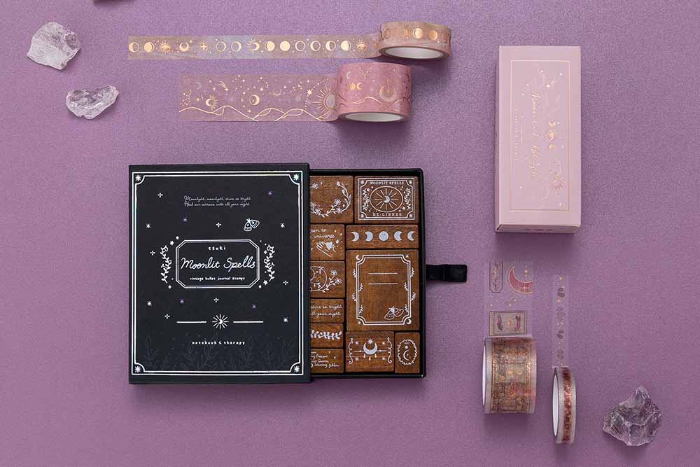 Tsuki ‘Moonlit Blush’ Washi Tape Set with Tsuki ‘Moonlit Spells’ Bullet Journal Stamp Set with amethysts stones on purple background