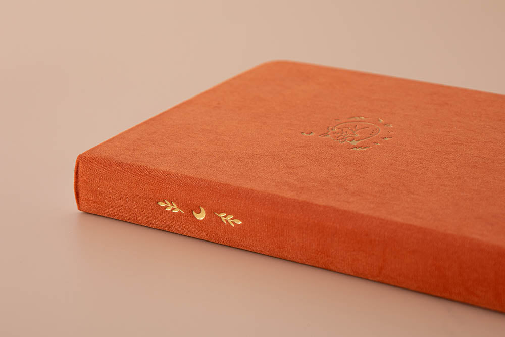 Close up of spine of Tsuki ‘Kitsune’ Limited Edition Fox Bullet Journal on beige background