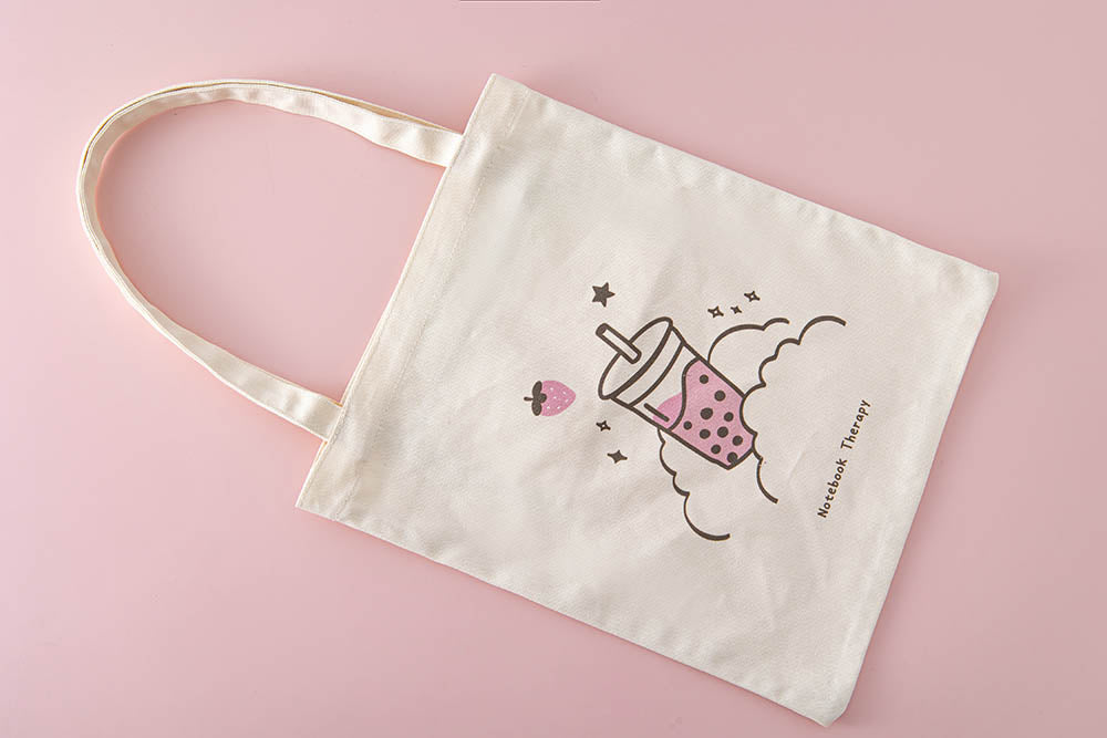 Tsuki ‘Ichigo’ Boba Tote Bag on light pink background