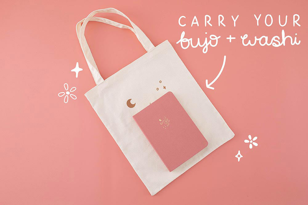 Tsuki ‘Moonflower’ Limited Edition Tote Bag to carry bujo and washi with ‘Suzume’ Limited Edition Bullet Journal on coral pink background