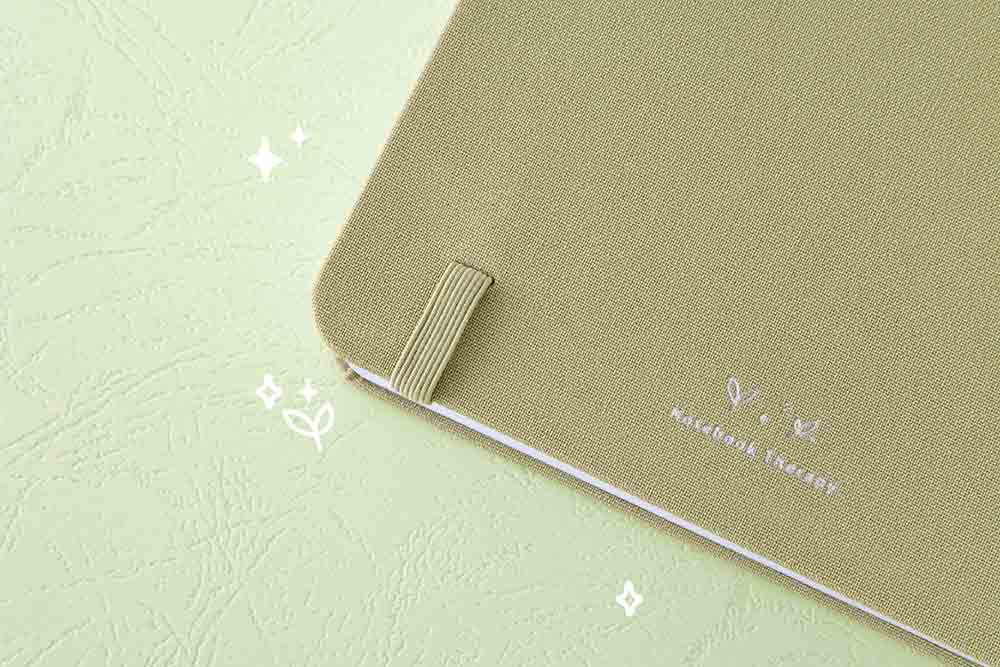 Close up of back cover of Tsuki ‘Matcha Matcha’ Limited Edition Bullet Journal on matcha green background