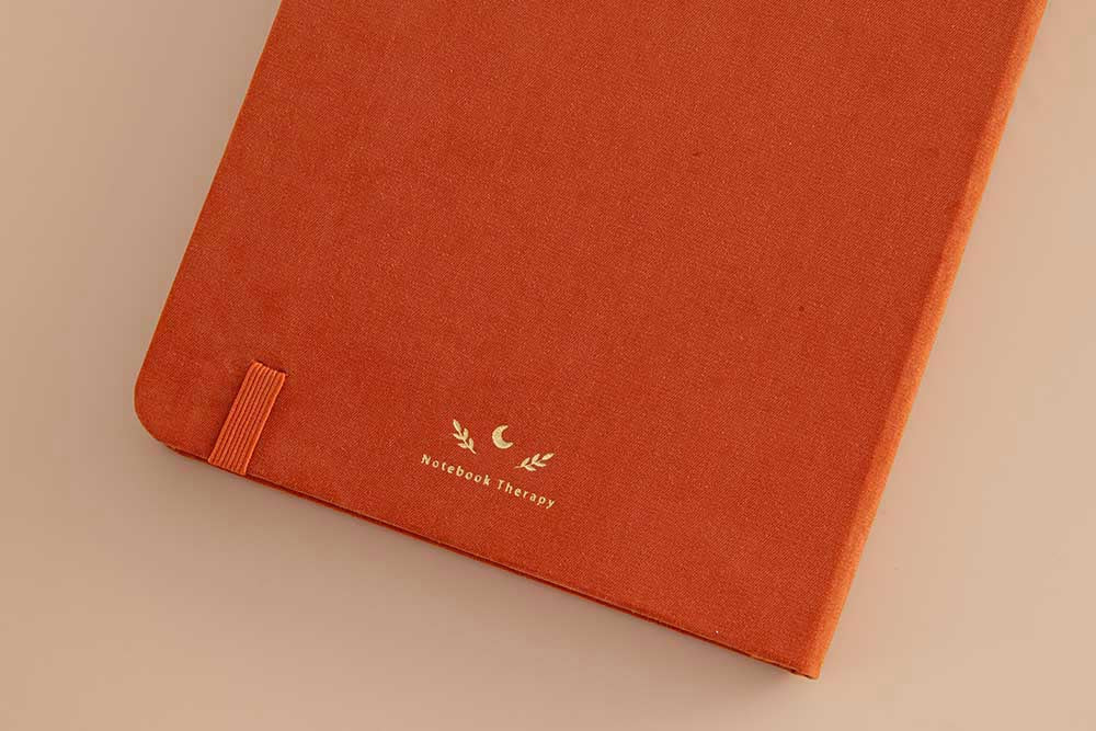Close up of back cover of Tsuki ‘Kitsune’ Limited Edition Fox Bullet Journal on beige background