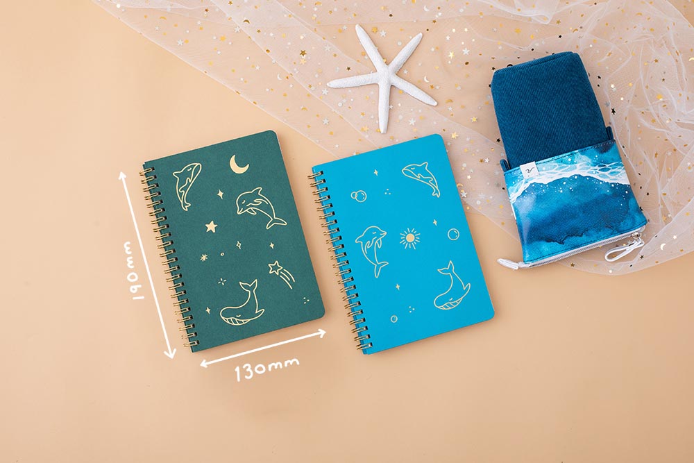 Tsuki Ocean Edition Ring Bound notebooks in aqua blue and deep teal with ocean edition pop up standing pencil case in ocean blue on peach background