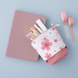 Tsuki 'Sakura Edition' Pop-Up Pencil Case in blush pink with Tsuki 'Sakura Edition' Washi Tapes on Tsuki 'Sakura' Limited Edition Bullet Journal in blush pink on light blue background
