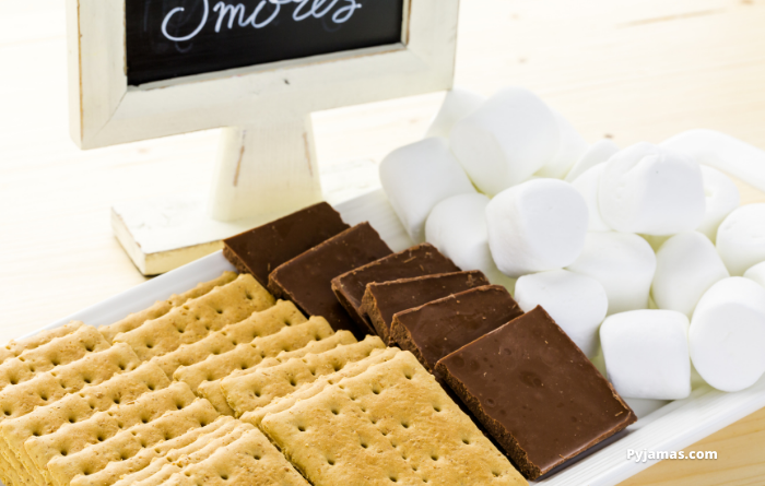 Biscuits, chocolate and marshmallows laid out for smores 