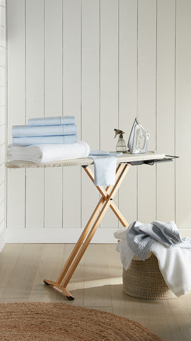 bedding and sheets on ironing board