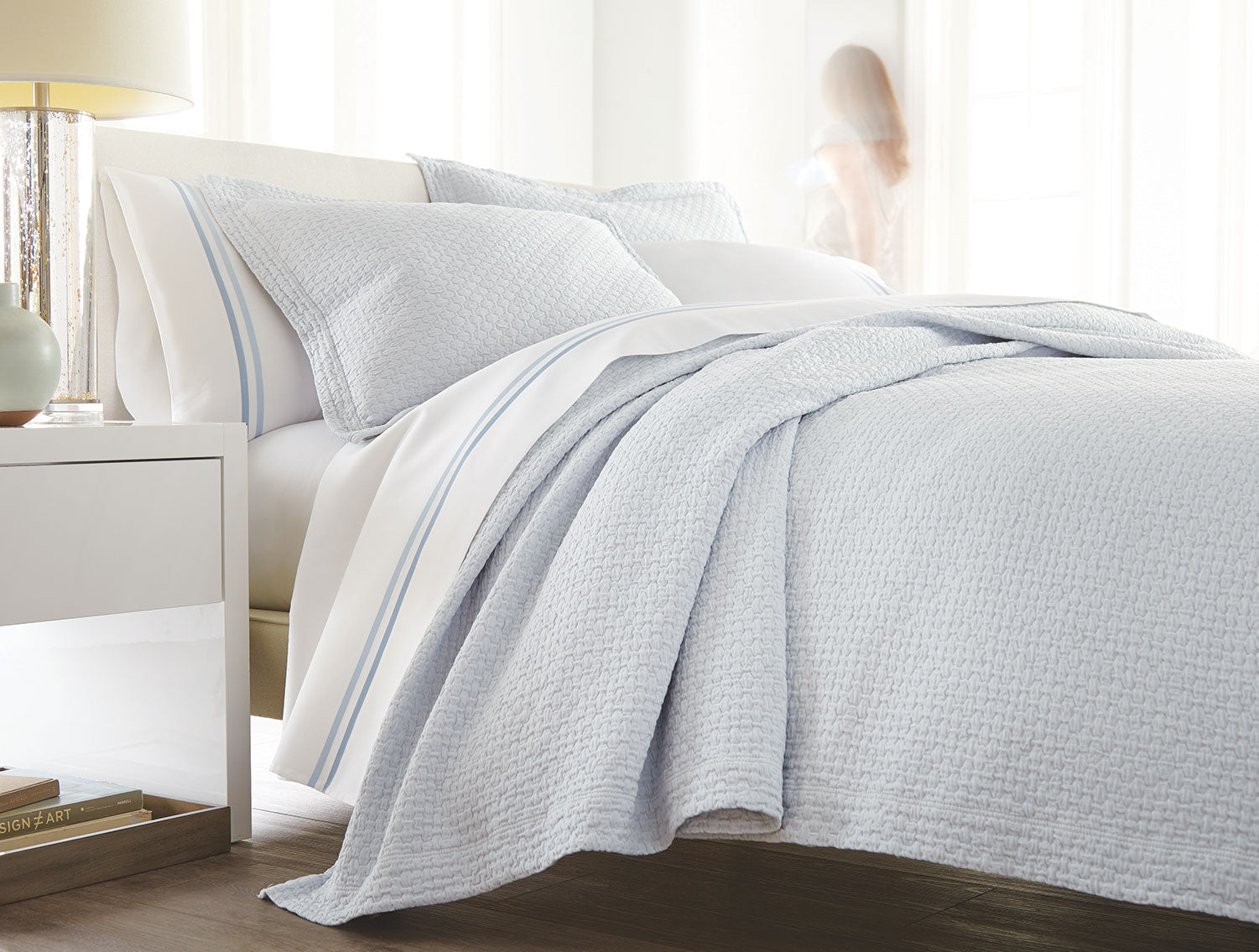 Barely Blue Juliet coverlet on bed with Duo striped sheets