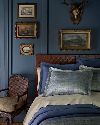 navy blue bedroom with dark blue bedding