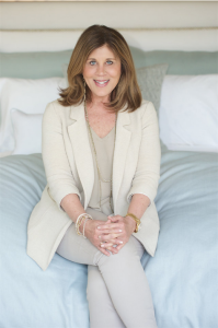 Suzanne Kasler posing with her bedding design