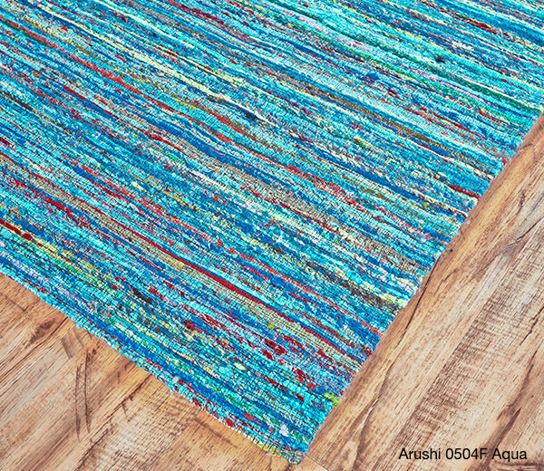 Detail of a Sari Silk rug from the Arushi collection in Aqua