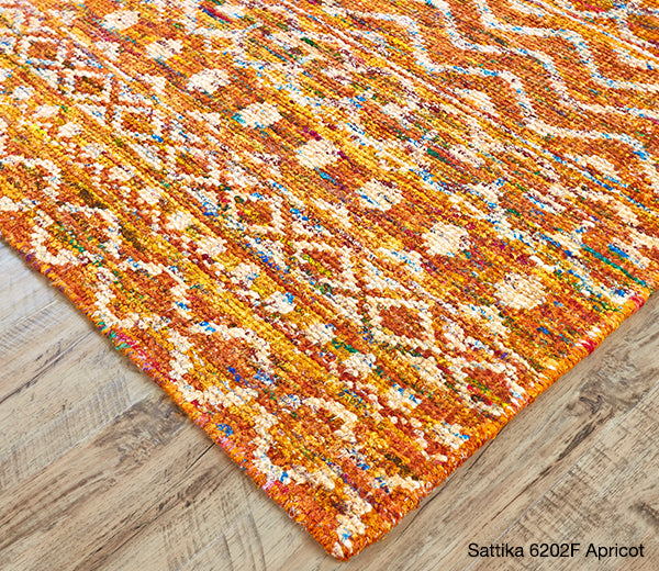 Detail of a Sari Silk rug from the Sattika collection in Apricot