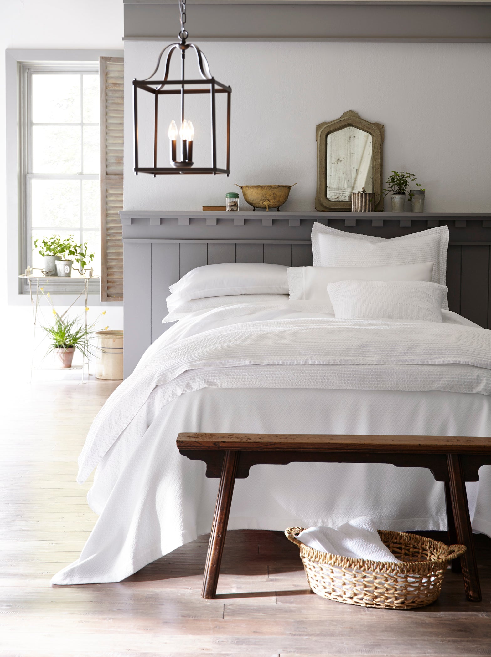 All white bed in a relaxed country-chic room