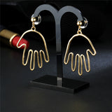 trendy gold color hollow hand shape drop earrings for women