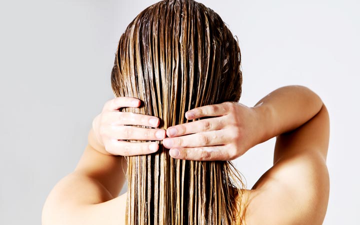 Woman holding her colored hair