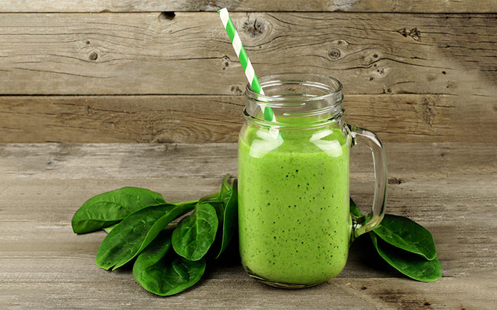 Healthy green smoothie with spinach in a jar