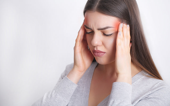 Woman having painful headache