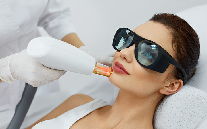 cosmetic laser procedures beautician uses skin