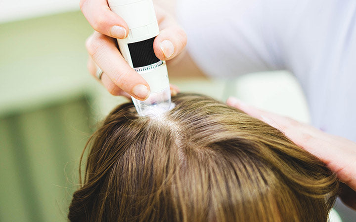 hair doctor checking hair and scalp