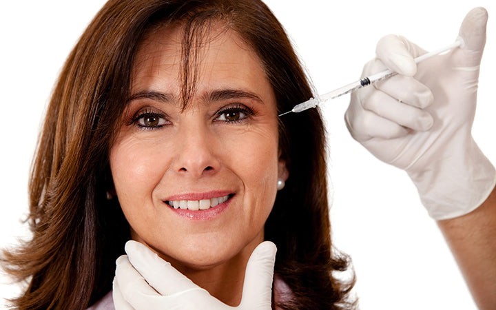 woman getting a face lift with botox