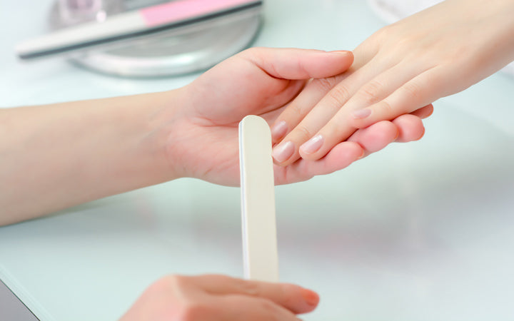 woman hands nail salon receiving manicure