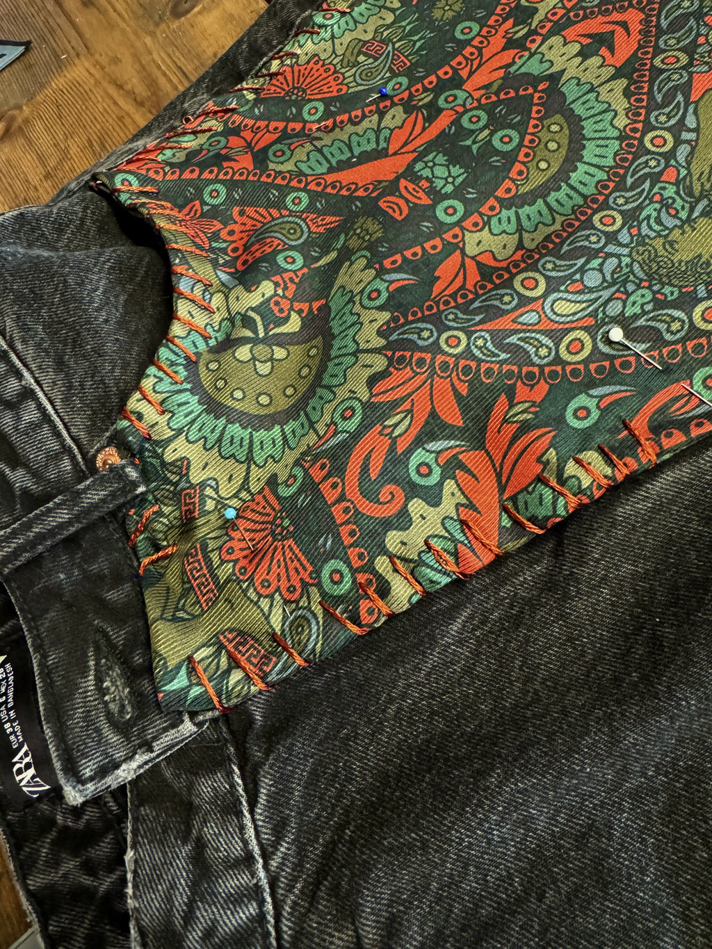 Fabric from Furious Goose's silk tie production being used to upcycle an old pair of denim jeans