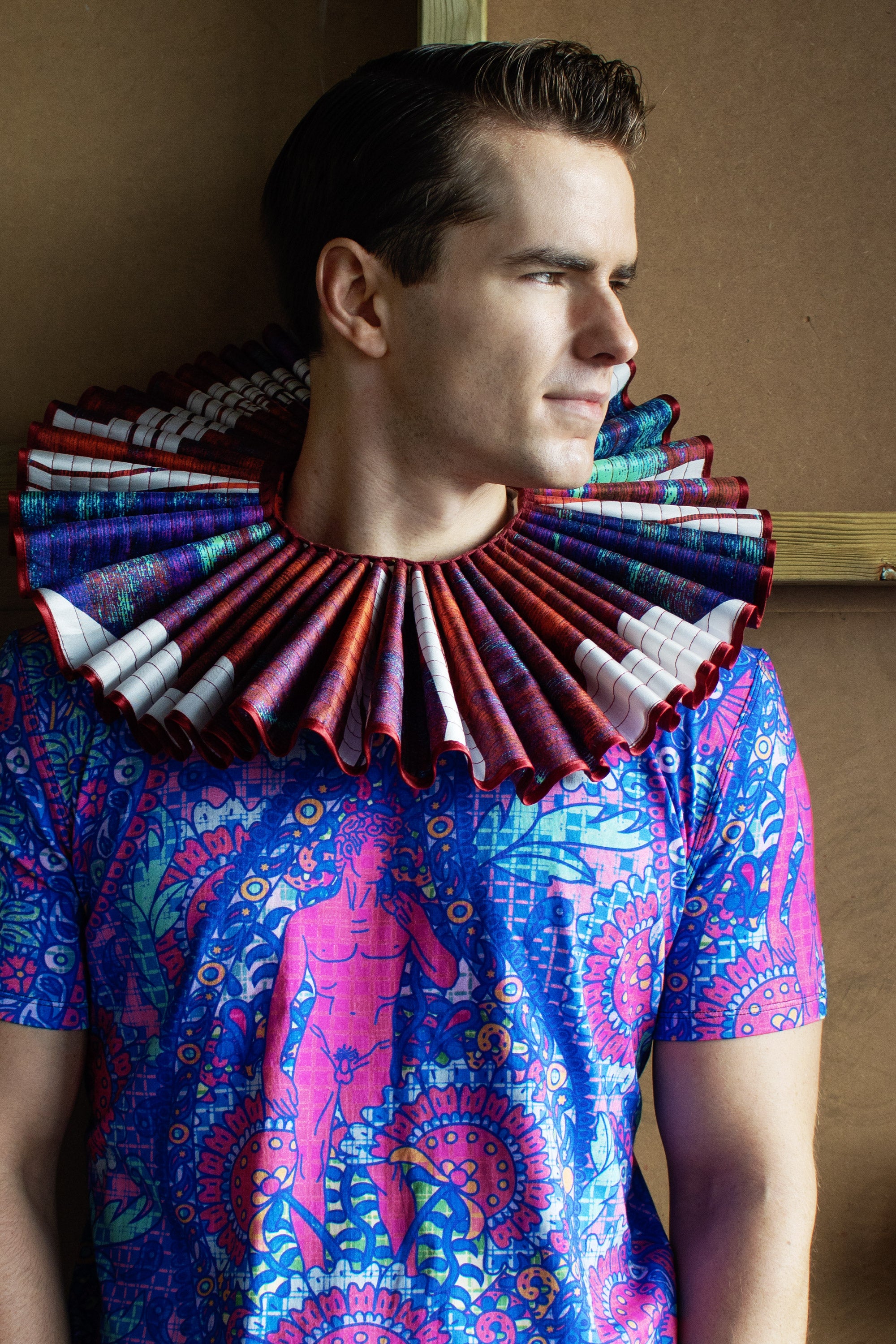 Male model wears a large size upcycled ruff made from damaged silk scarves