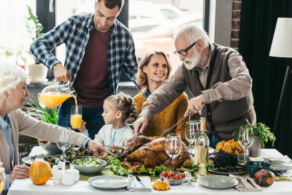 Family enjoying thanksgiving dinner.