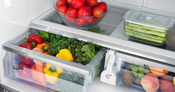 Vegetables stored in the refrigerator's crisper drawer.