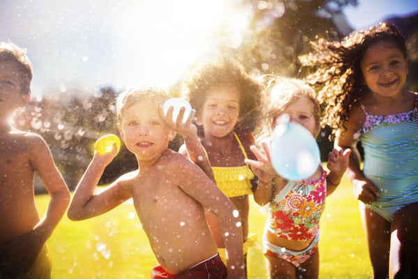 Kids having fun at a water balloon party