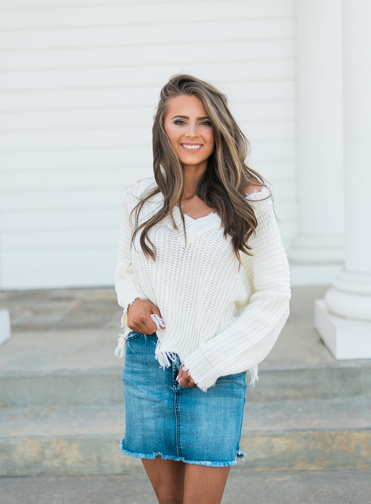 frayed white sweater