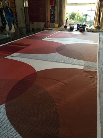 Jane Keith - Large silk square scarves drying on table after printing