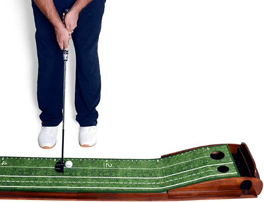 practicing on the perfect practice putting mat