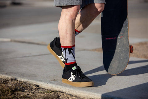 Mike Vallely wearings shorts with SOCCO socks with Cariuma Shoes