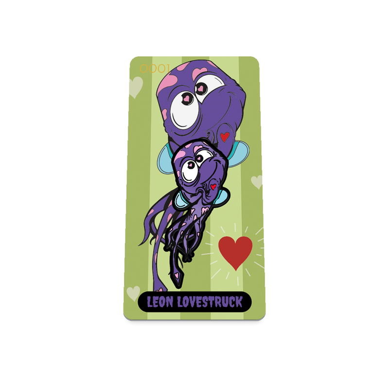 Product photo of the front of the collector’s of 2021 - Day 10 - Leon Lovestruck. It has a green background with two lighter shaded green stripes and repeating white hearts and one red heart displaying two purple monsters with pink hearts all over and one red heart and blue wings. Purple 'LEON LOVESTRUCK' text.
