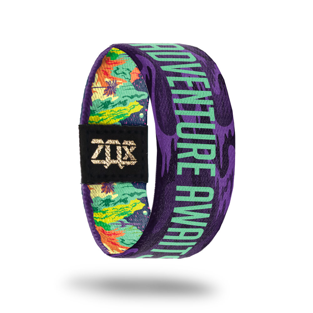 Adventure Awaits-Sold Out-ZOX - This item is sold out and will not be restocked. Purple base with orange, yellow and green beach scene. The inside is the same and says Adventure Awaits in teal. 