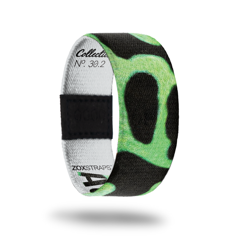 Auratus-Sold Out-ZOX - This item is sold out and will not be restocked. Solid black strap with neon green circular shapes. Inside is solid white and says Auratus. 