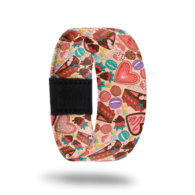 Be Sweet-Sold Out-ZOX - This item is sold out and will not be restocked. Pale pink strap with tons of multicolored desserts- suckers, cookies, pie, macaroons, candy hearts. Inside is the same design and reads Be Sweet To Yourself.  