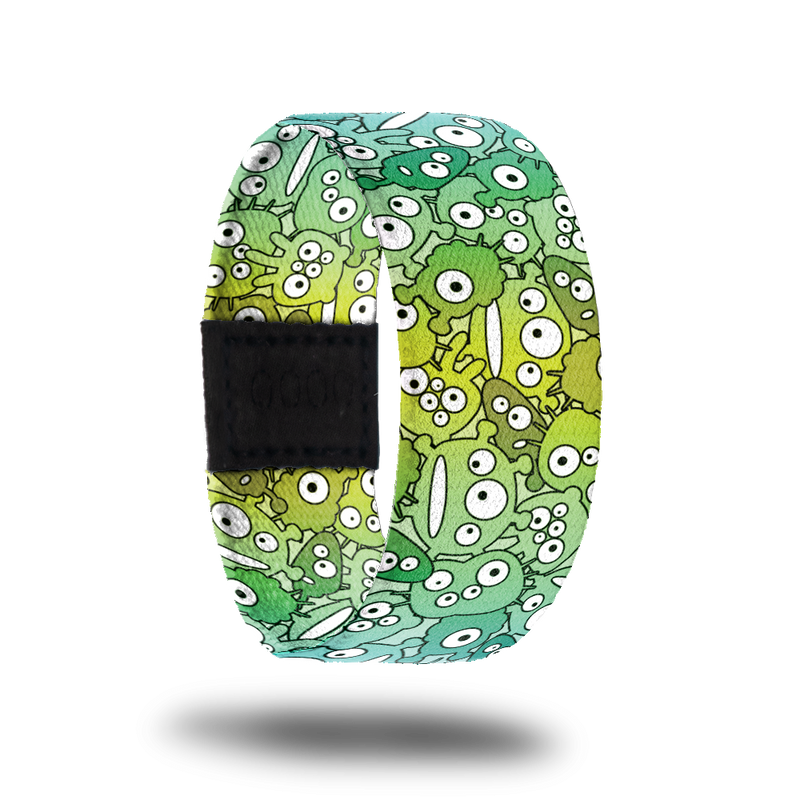 Be Weird-Sold Out-ZOX - This item is sold out and will not be restocked. Bright green strap with cute cartoon monsters all over in various shades of green. Inside is the same and says Be Weird. 