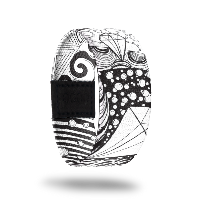 Balanced-Sold Out-ZOX - This item is sold out and will not be restocked. White strap with abstract black line drawing all over. Inside is the same and says Balanced. 